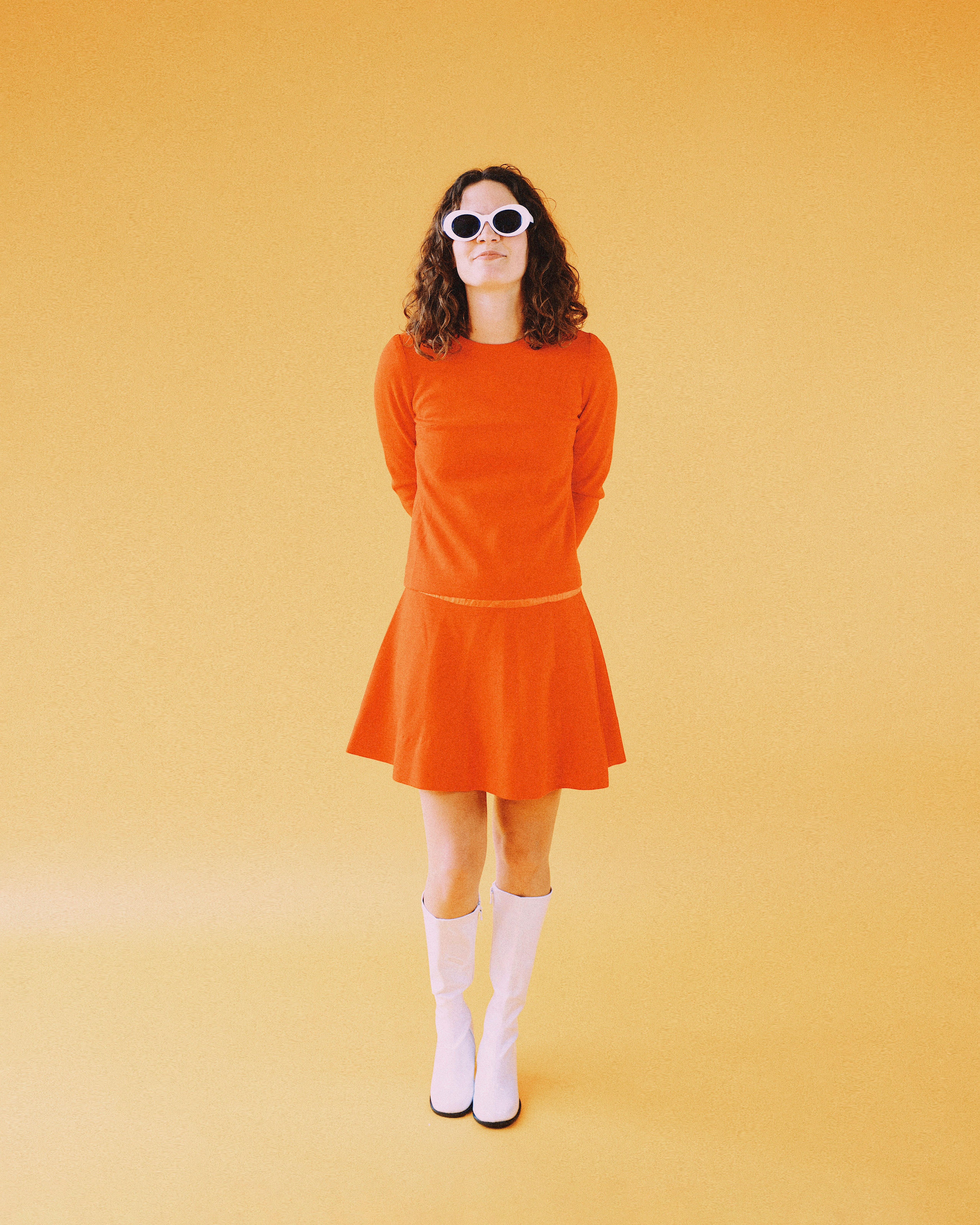 woman wearing orange long-sleeved dress
